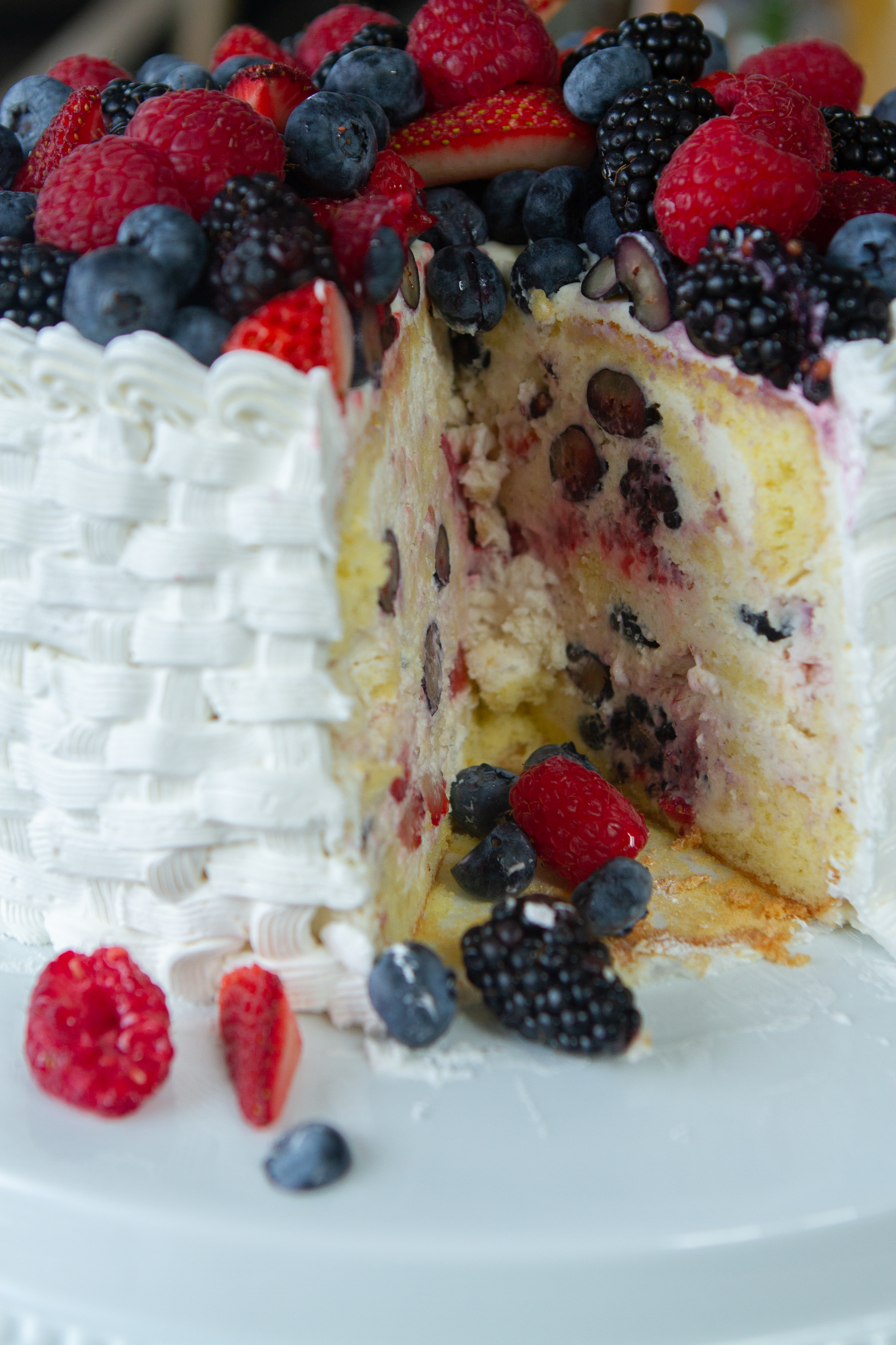berry cake with cut out slice